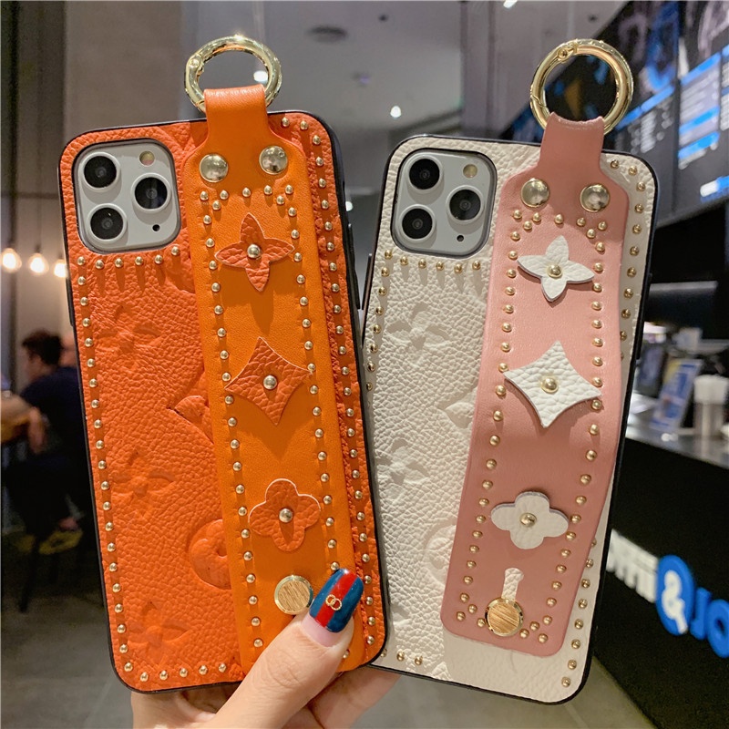 Luxury Lady Style Genuine Leather Wrist Rivet Phone Case with Wrist band for iPhone 11 pro max Phone Cover Case